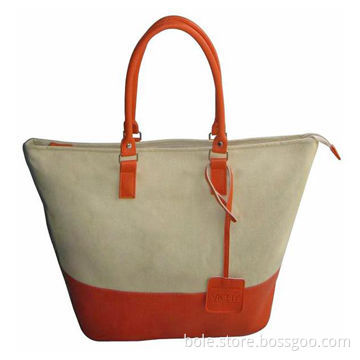 Canvas handbag with contrast color design, PVC handle and #5 nylon zipper and silver handware